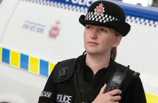 Greater Manchester Police female officer with Sepura radio