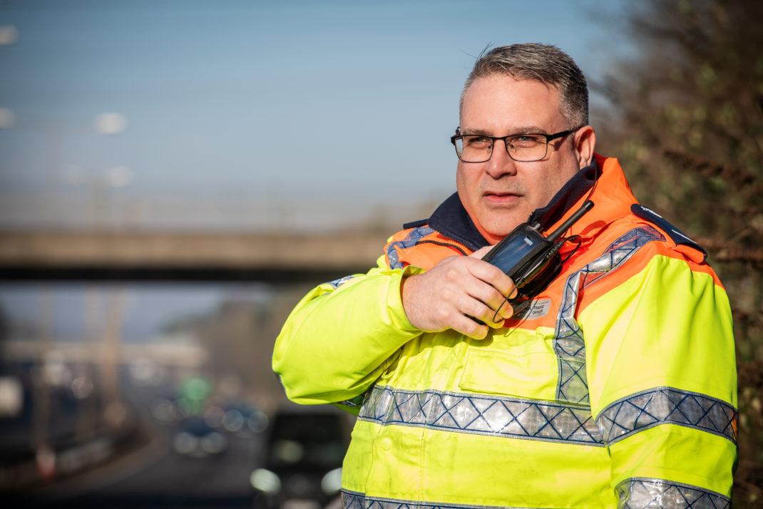 Highways England Traffic Officer Speaking into his Sepura SC20 Radio