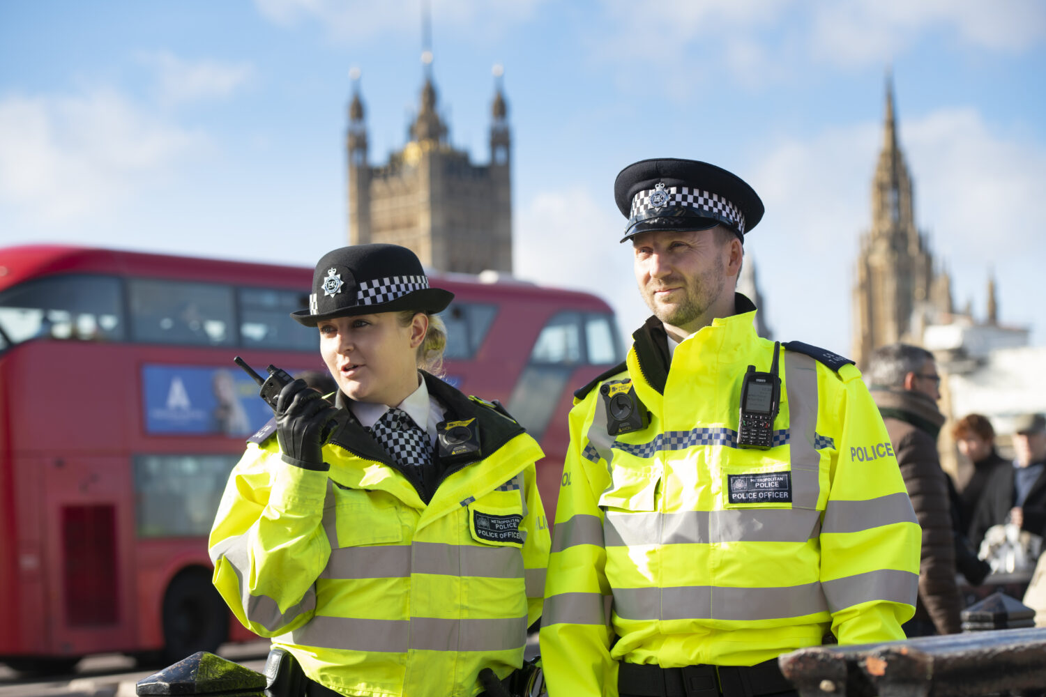 Male and female Metropolitan Police Officers with SC20 and SC21 Sepura Hand-portable Radios